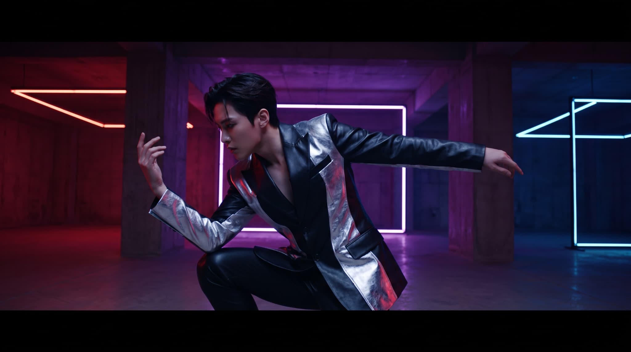 Performer moving through a neon-lit music video set